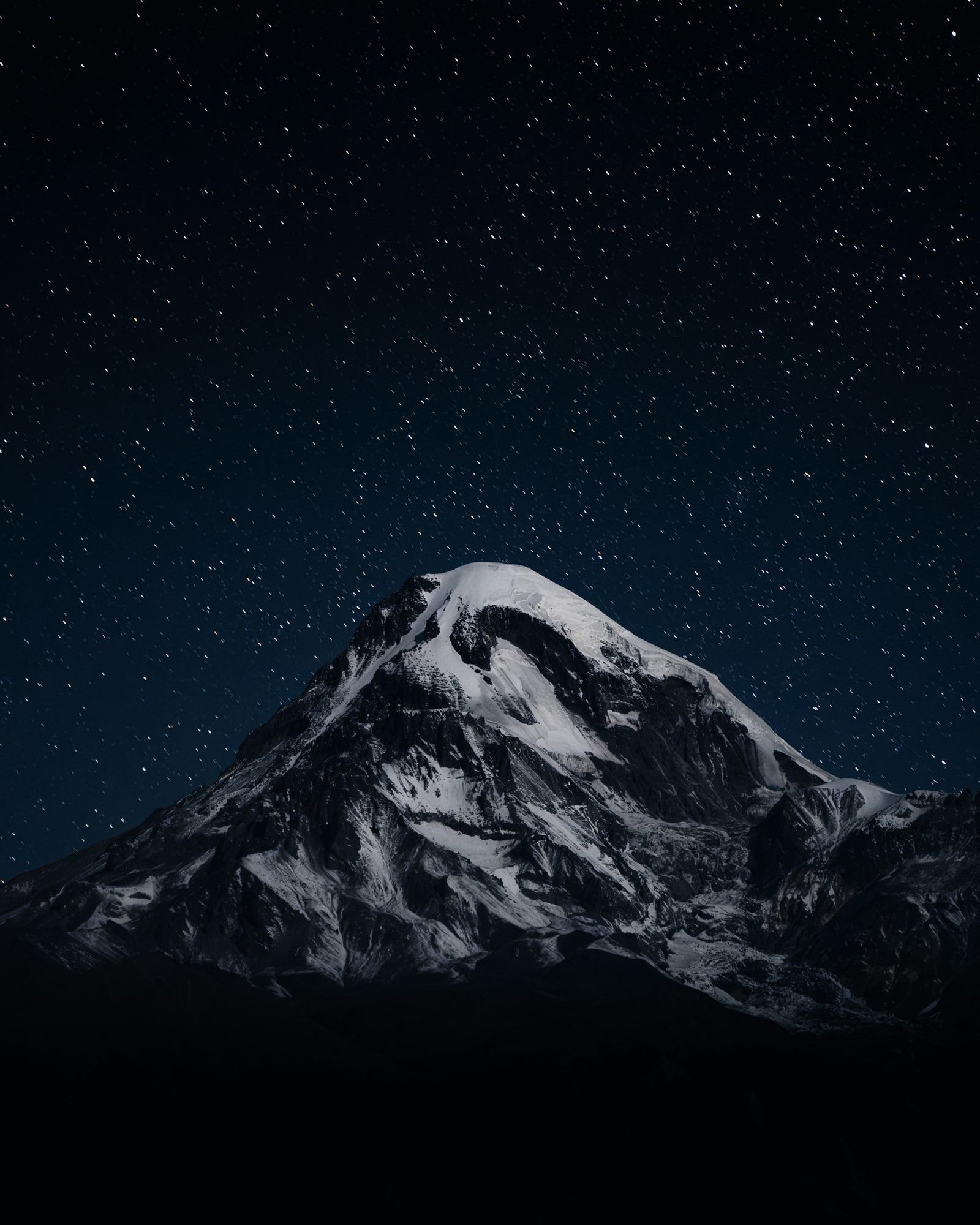 Snow peak under starry sky
